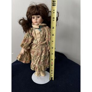 Vintage porcelain doll brown wavy hair floral dress 12 inches no box with Stand‎